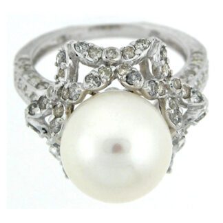A white pearl and diamond ring.