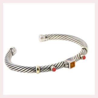 A David Yurman Sterling Silver & Gold Bracelet with a red stone and a silver cuff.