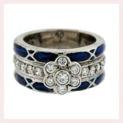 A Sterling Silver Ring with Blue Enamel & CZ Flower with diamonds and sterling silver accents.