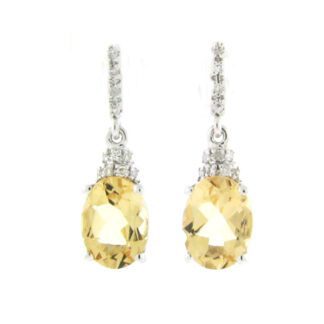 A pair of earrings with citrine and diamonds.
