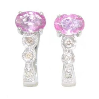 A pair of pink sapphire and diamond earrings.