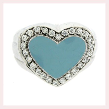 A Sterling Silver Heart Ring with CZ & Enamel 925 with a blue stone and diamonds. This stunning ring combines the elegance of a heart shape, the brilliance of diamonds, and the mesmerizing blue hue of the main stone.