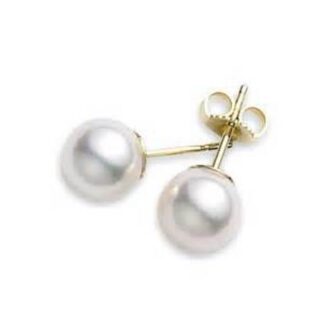 A pair of pearl stud earrings in yellow gold.