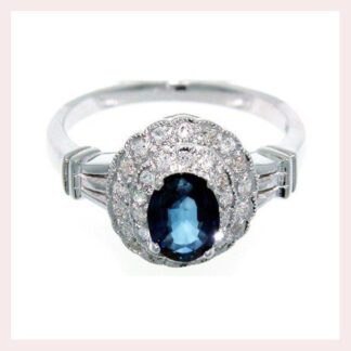 An oval Vintage Sapphire & Diamond Ring in 14KT Gold.