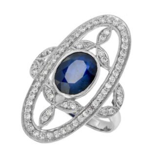 An oval sapphire and diamond Art Nouveau ring. 

Art Nouveau Ring with Ruby & Diamonds in 14KT Gold.