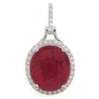 A pendant with a ruby stone and diamonds.