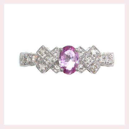 A Pink Sapphire .52TW & Diamonds .10TW Ring in 14KT White Gold.