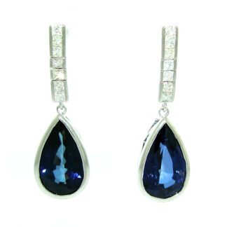 A pair of pear sapphires and diamonds earrings crafted in 14KT gold.