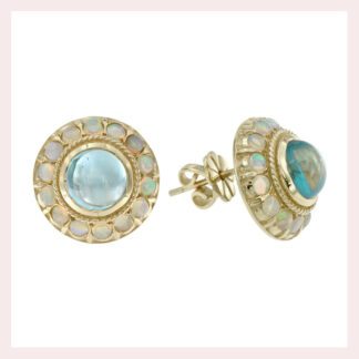 A pair of Blue Topaz 3.25TW Opal 1.08TW stud earrings in 10KT yellow gold.