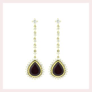 A pair of Dangle Ruby & Diamond Earrings in 14KT Yellow Gold with a garnet stone and additional diamonds.
