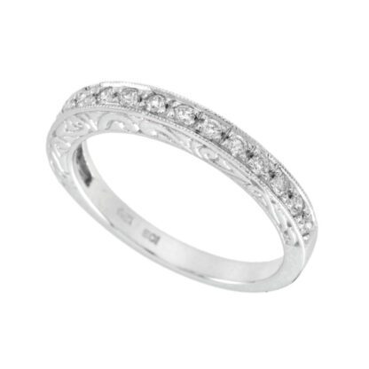A Wedding Band with Diamonds in 14KT Gold.