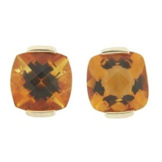 A pair of citrine stud earrings in yellow gold.