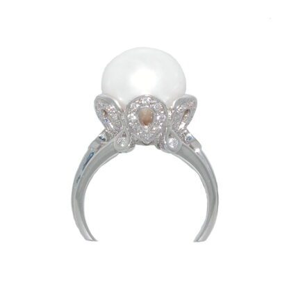 A white pearl and diamond ring.
