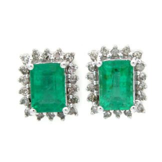 Stunning Emerald & Diamond Earrings in 14KT White Gold, crafted in 14KT gold.
