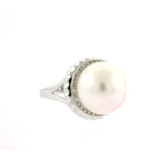 A white pearl and diamond ring on a white background.